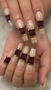 Compress Burgundy Folds Between Brass Ends