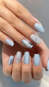 Ice Blue Elevator Nails With Minimal Button Layouts